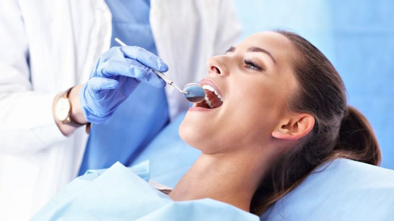 Girl Having Dental Examination By Dentist